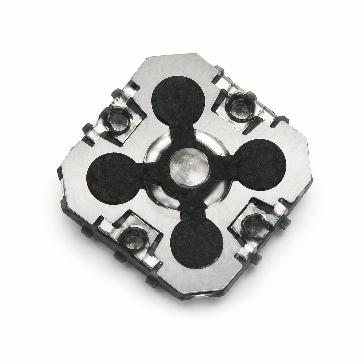 Close-up of a metallic mechanical part: a square silver plate with three black circular pads arranged around a central hub.