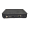 Rear view of a small black media device showing coaxial input, USB, HDMI, Ethernet, audio jack, and power port.